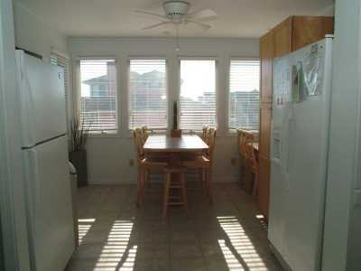 Spacious and sunlit kitchen boasts two of everything-fridges, diswasher, microwaves, and sinks