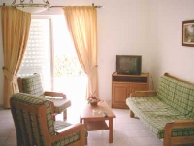 Spacious living-room with TV.