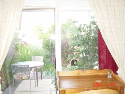 The master bedroom looks out on its own private patio with Mexican firepit.