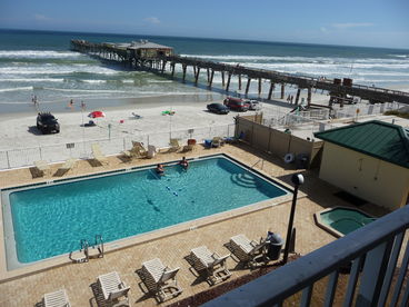 The Sunglow Pier, our pool deck with hot tub as viewed from our direct ocean front balcony