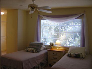 twin beds, large walkin closet with vanity