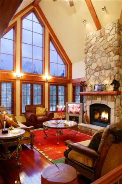 Floor to ceiling windows, fireplace with firelogs supplied.