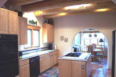 Large well-equipped gourmet kitchen.