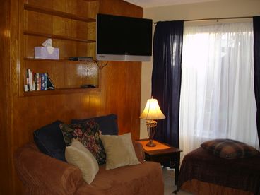 T.V. is a 27 inch flat screen with satellite and cable