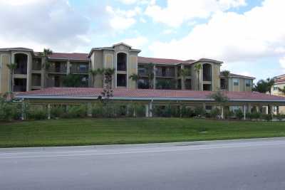 Front of condo with covered parking