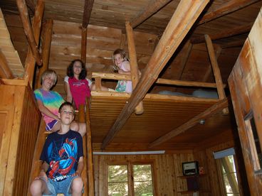 Four twin beds in sleeping loft.