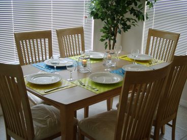 Indoor eating area complimented by bar stools seating 8.