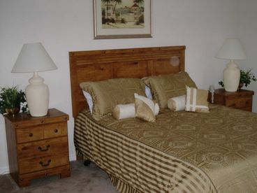 master Bedroom. Queen sized Bed on suite facilities walk in closet.