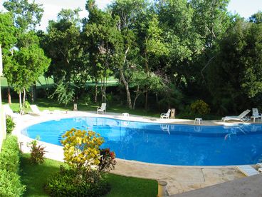 The stunning view of the pool and golf course from the terrace