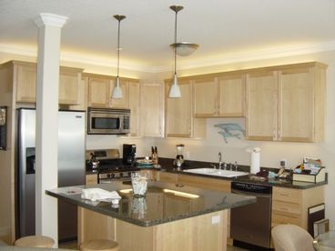 Beautiful kitchen with granite counters and stainless steel appliances... and a view!
