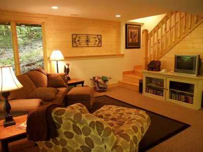 The Family Room has a sleeper sofa, and another TV/VCR/DVD, stereo, video library, games, game table & play table.
