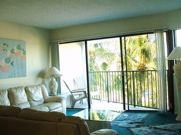 Living Area with Veranda and Breeze Filled Palm Trees beyond