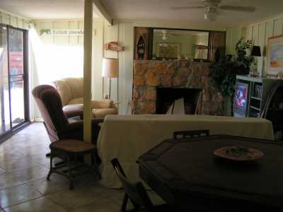 Den has pull-out couch, 2 recliners, TV with DVD/VHS, Bumper Pool table, Sliding Glass doors to fenced in yard