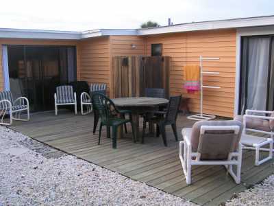 Patio with BBQ and table and Chairs. Outside Shower