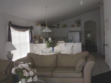 Lounge leading out to pool with dining area and kitchen