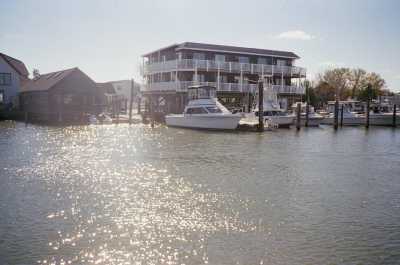 Yacht harbor condo. Upper end unit on left facing picture.