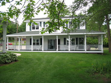 The lower carriage cottage has a large wrap around porch with views of the lake.  The upper carriage cottage with its walk out patio offers a place to sit with your morning coffee or afternoon cocktail and see the lakes activities.