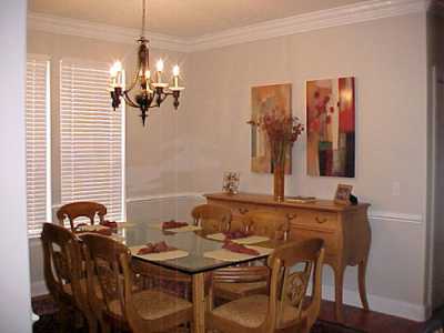 Elegantly furnished, dining room, double living room, private den with french doors.