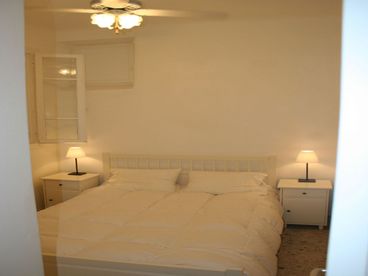 1st Floor - Queen size bed with ceiling fan.