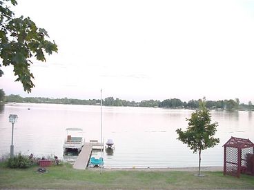 Sandy lake frontage and beach area with gradually descending water.  Does not drop off quickly until ~100 ft out.  Great for smaller children.  Fishing off dock is always a highlight.