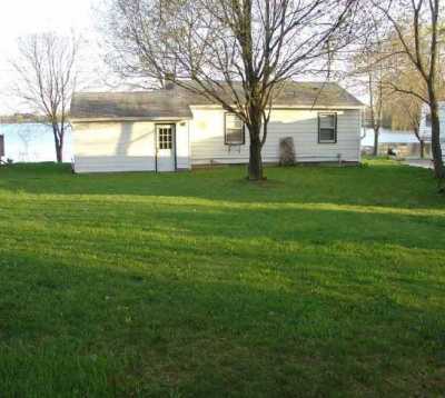 Back side of cottage.  The cottage is on just under an acre of property.  This photo shows just part of the large backyard where there is plenty of room to play all sorts of out door yard games and activities.