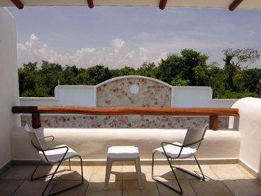 Private terrace by master bedroom with pool views