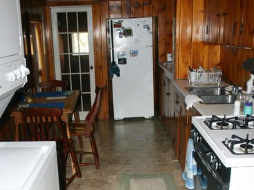 Updated Kitchen, lots of cabinet space,
and beyond glass door is mudroom and entrance to apartment from back of house.