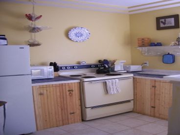 The kitchen is small, but with the original sink and all basics to cook, bake or reheat  meals when you dine out. 