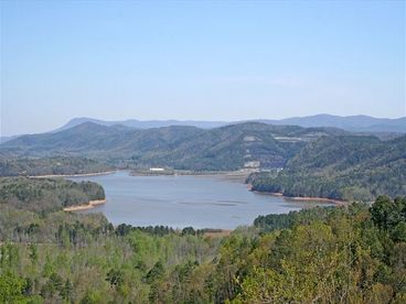 View of Carters Lake across from the resort along with the Dam for all to see. Go there and rent a boat for the day and take in this 470\' ft. deep lake .