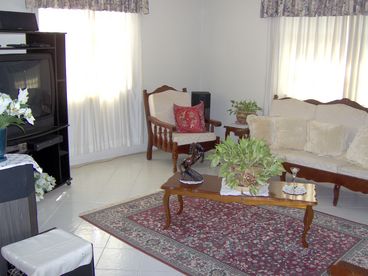 The front family room with bose home theatre system sat and 36 inch tv.