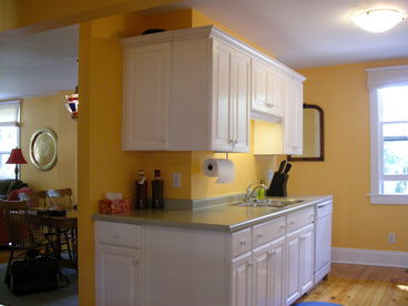 The kitchen, with dishwasher, microwave, fridge and stove.