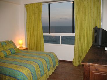 Large master bed room with sea view and color TV