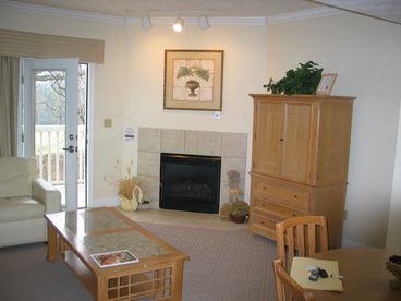 LIVING ROOM WITH YR ROUND FIREPLACE AND BALCONY WITH MOUNTIAN VIEWS OVERLOOKING GOLF COURSE