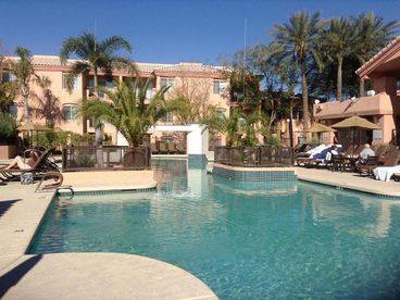 Clean sparkling and inviting pool with attractive surrounding foliage