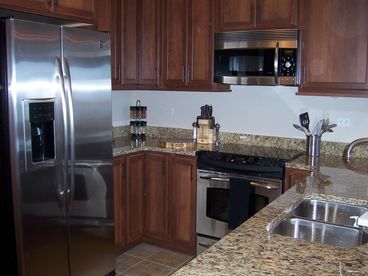 Top of the line kitchen with granite countertops and stainless steel appliances.  A great place to entertain!