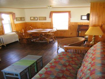 The Shore View has a cozy living dining area, just off the kitchen with a dining table great for family game nights.