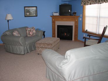 Comfortable Living Room has gas fireplace, cable TV, DVD player