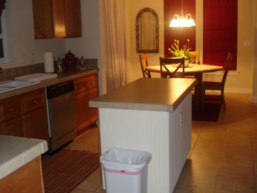 The Dining room has a slider that open to the back yard and hot tub area.