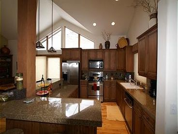 Spacious gourmet kitchen with seating for 4 at counter. 