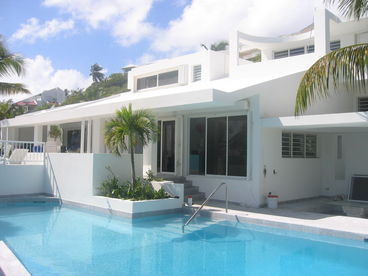 oversized pool is just steps to the beach