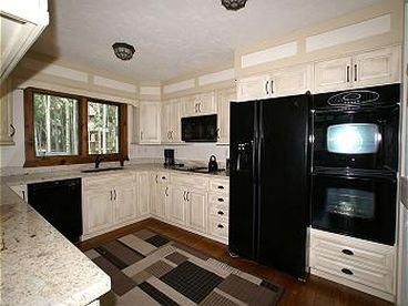 Kitchen - Jenn-Air stove, microwave, double-oven, dishwasher, and plenty of room. 