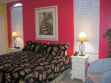 Master bedroom on 1st floor with access to covered porch.