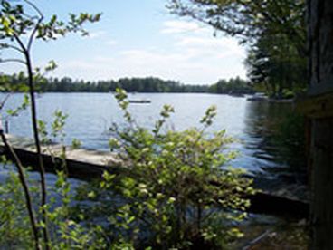 View of the lake and the dock on the left side of the front yard.