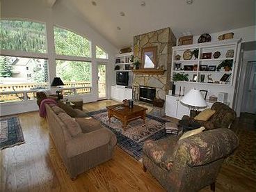 Living Room - Fireplace and cozy seating with expansive views. 