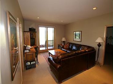 Lower Level Family Room - TV/VCR, desk with fax machine, printer, and hi-speed internet modem. Walk out out patio doors to hot tub. Full bathroom. 