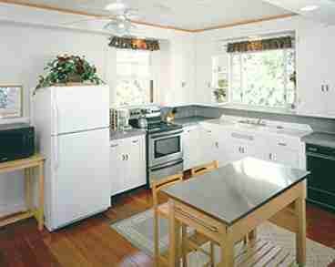 FULLY EQUIPPED KITCHEN WITH GRANITE COUNTERTOPS, NEW APPLIANCES, RECESSED LIGHTING.
