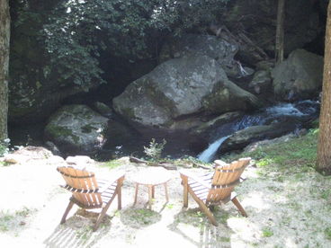 Rock on the porch and enjoy the view, and sound, of the creek. 