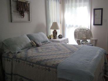 Queen bed with full bath shared with twin bedroom. Both bedrooms open to balcony overlooking the creek.