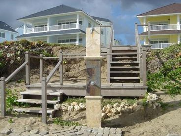 Stairs and shower from the beach to the community grounds.