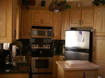Prepare complete meals with a full kitchen with microwave, oven , refrigerator with ice maker. Covered grilling and picnic area connected to the house.